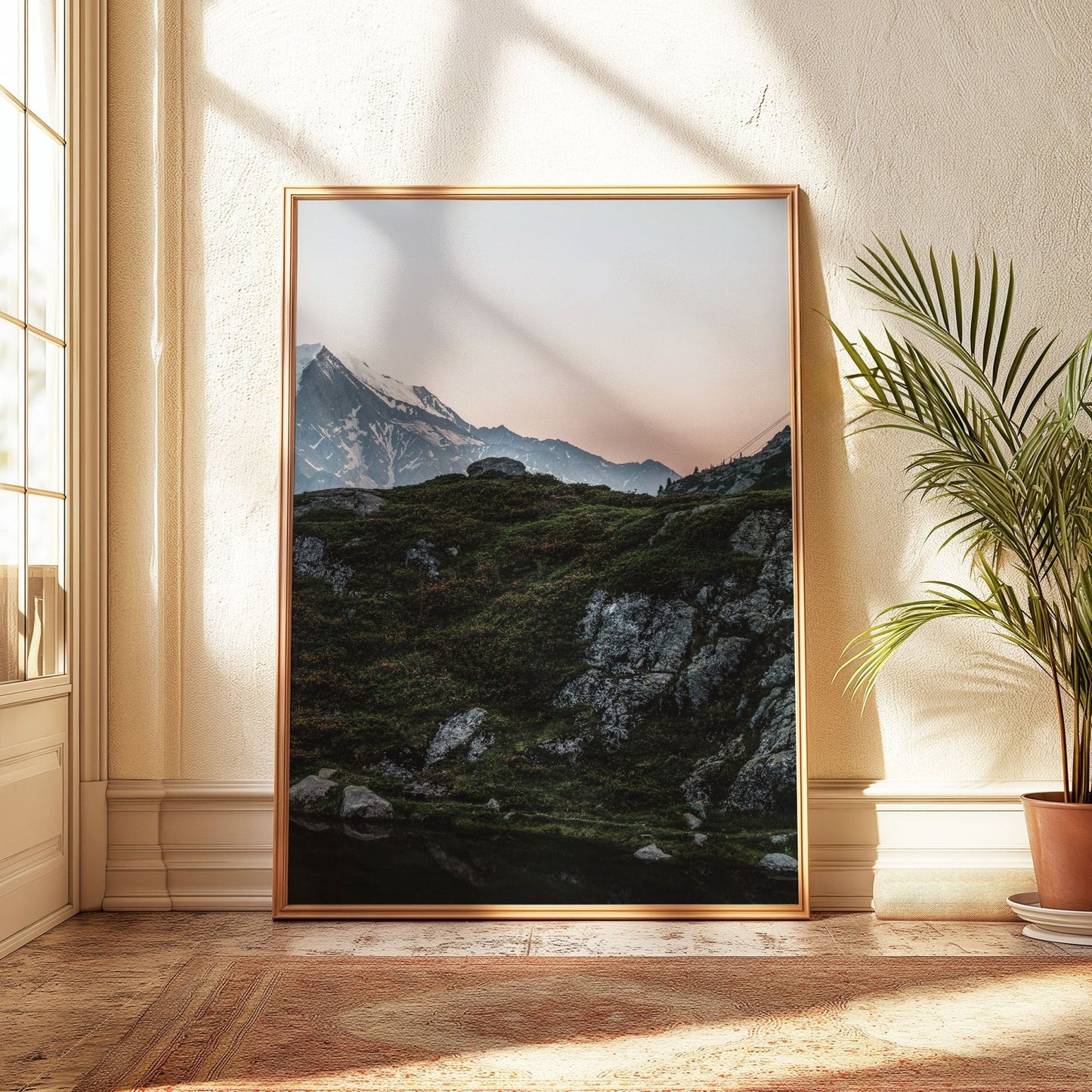 Dusk at Lac de la Flégère with a serene pink horizon and rugged mountain silhouettes.