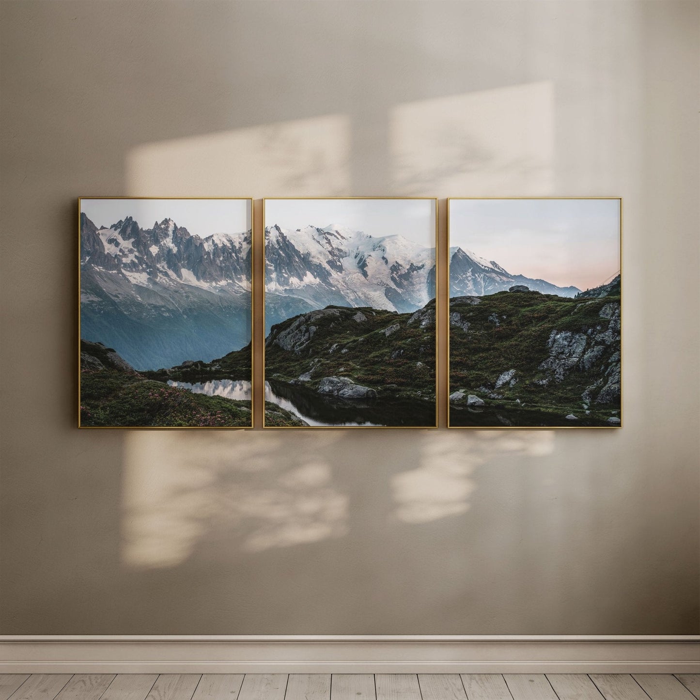 View of Aiguille Rouges reflecting in Lac de la Flégère under soft evening light.
