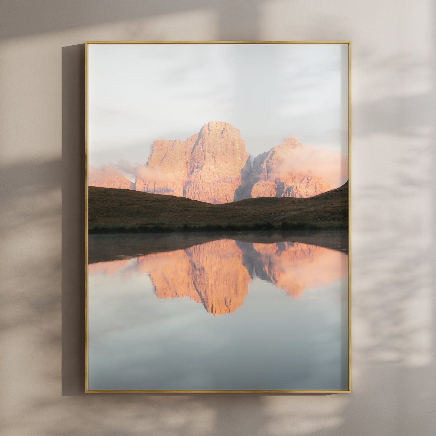 Sunrise view of Lago delle Baste with mountain reflection in the Dolomites