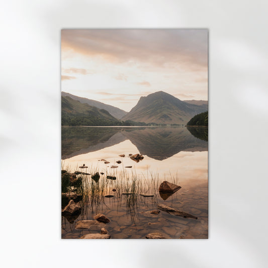 Unframed Buttermere landscape print showcasing calm lake waters and peaks at golden hour.
