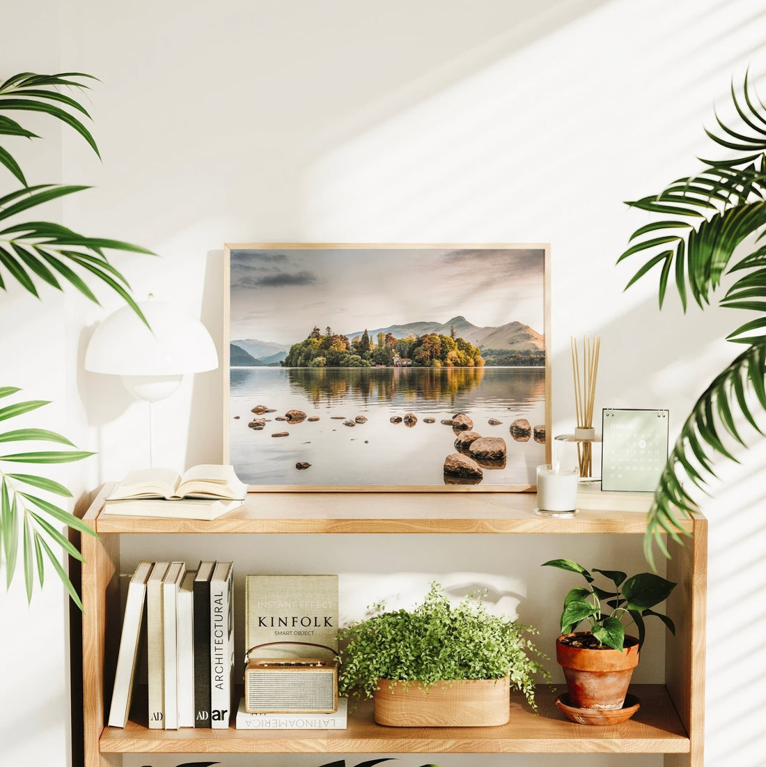 Derwentwater sunrise print styled with houseplants and wooden decor