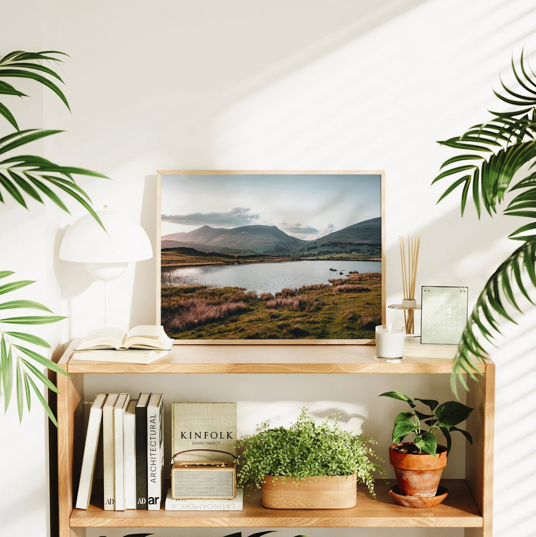Tewet Tarn photography print styled in bright interior on bookshelf