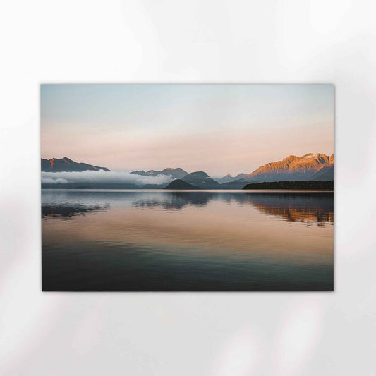 Unframed Lake Manapouri fine art print on white background showing golden hour mountain reflection in still water