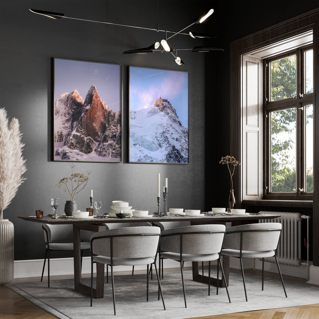 Elegant framed Les Drus and Aiguille du Midi prints in a modern dining room setting.