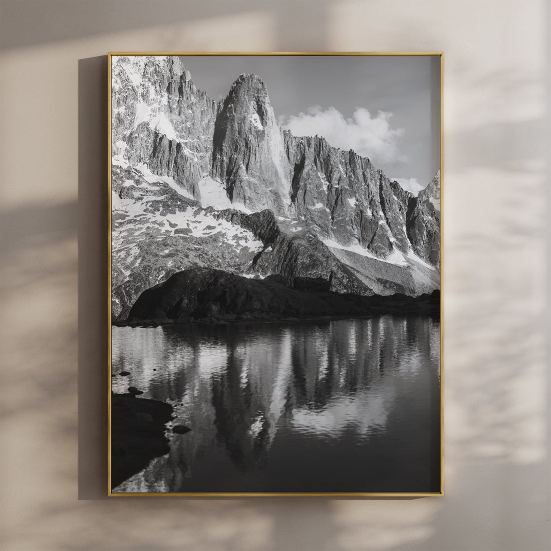 Stunning black-and-white wall art of Les Drus mountain, reflecting in a tranquil alpine lake.