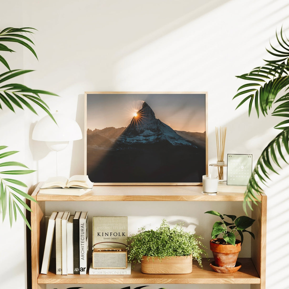 Landscape photography print of the Matterhorn at golden hour in a cosy shelf setup.