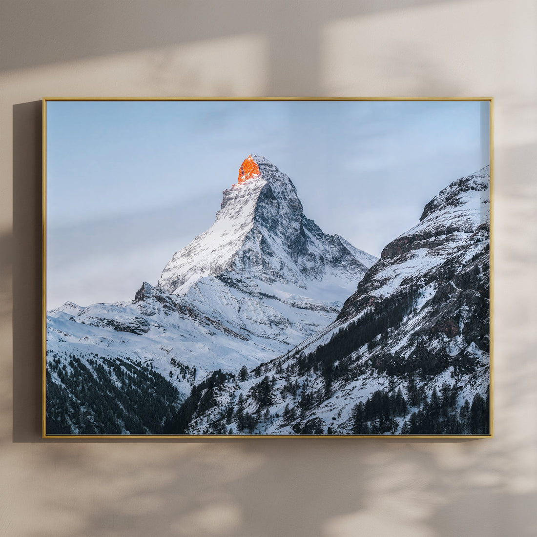 Minimalist Matterhorn wall art print with golden sunrise hitting the Swiss Alps peak in Zermatt.