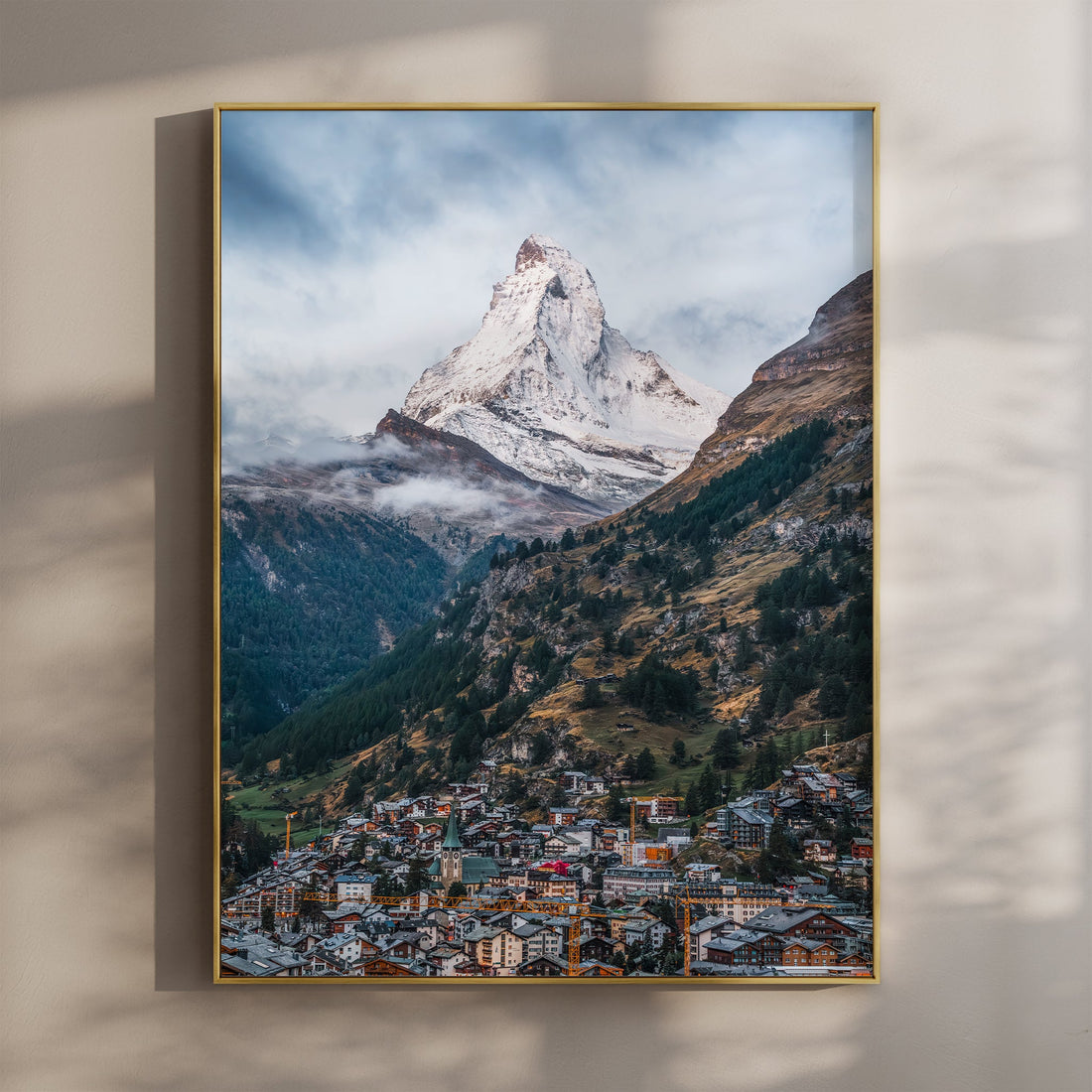 Fine art print of the Matterhorn above Zermatt with golden light and dramatic clouds.