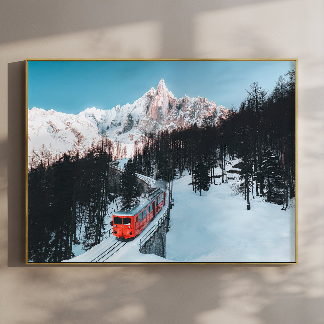 Stunning Mer de Glace Alps wall art featuring a red train winding through a snowy mountain landscape.
