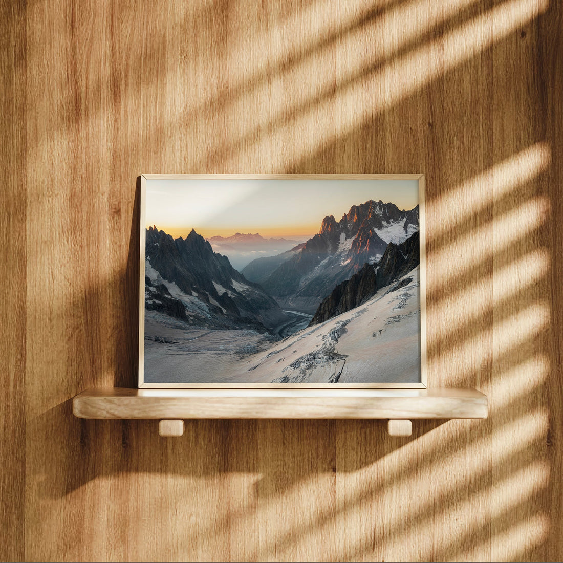 Sunset view of Mer de Glace glacier with warm alpine light hitting Mont Blanc Massif in this elegant art print.