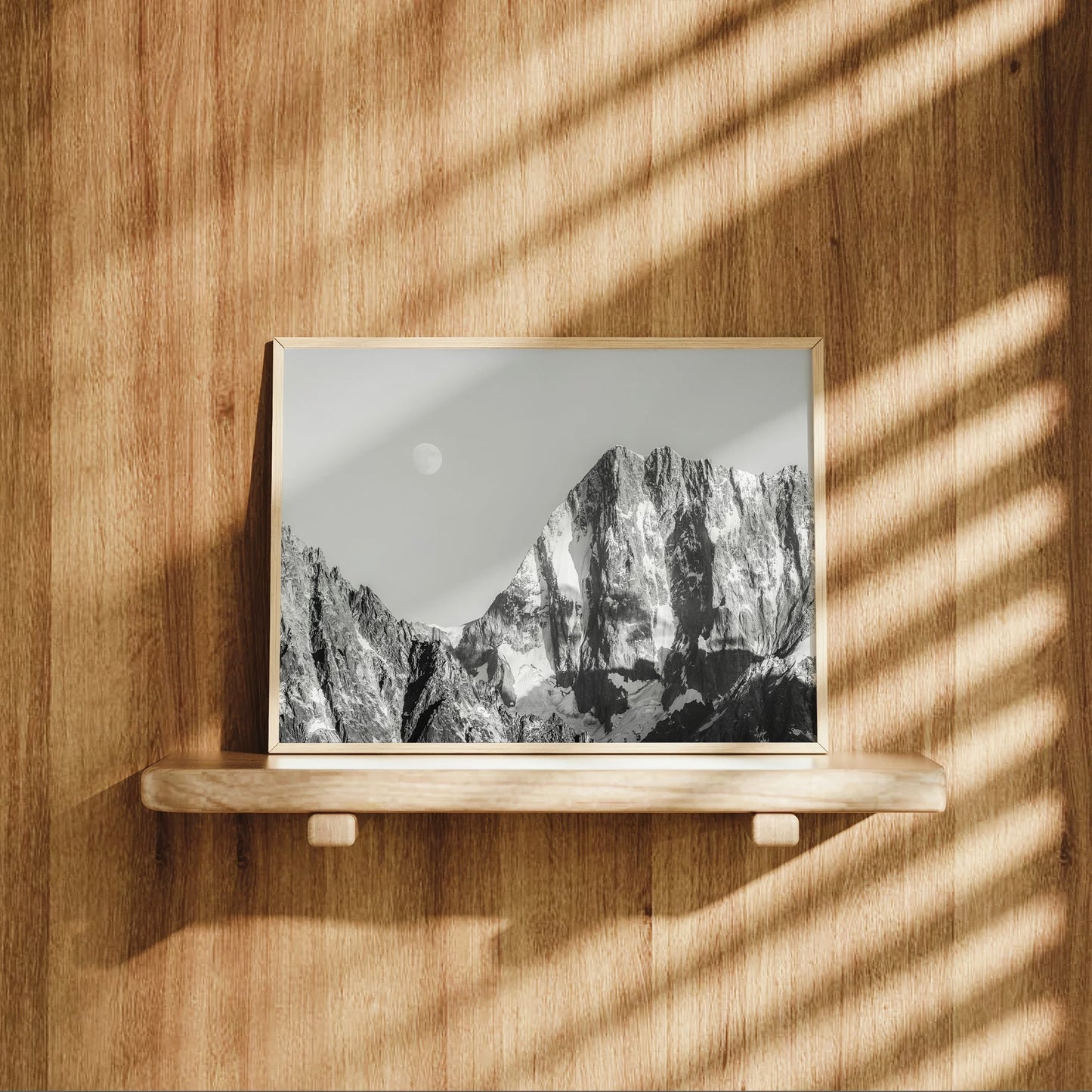 Minimalist black and white photo print of Grandes Jorasses in Chamonix with soft alpine shadows and the moon above.
