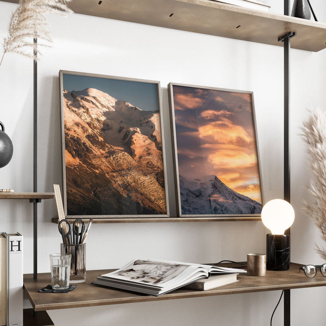 Mont Blanc print on a shelf next to Aiguille du Goûter print in a minimal workspace setting.