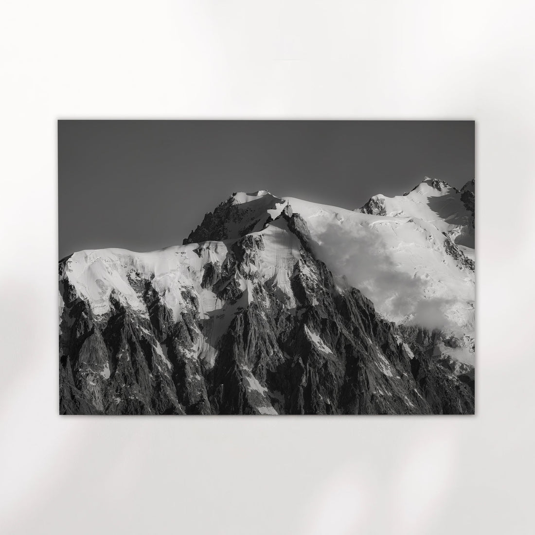 Monochrome Mont Blanc photo print capturing the dramatic face of Aiguille du Midi under moody alpine skies.