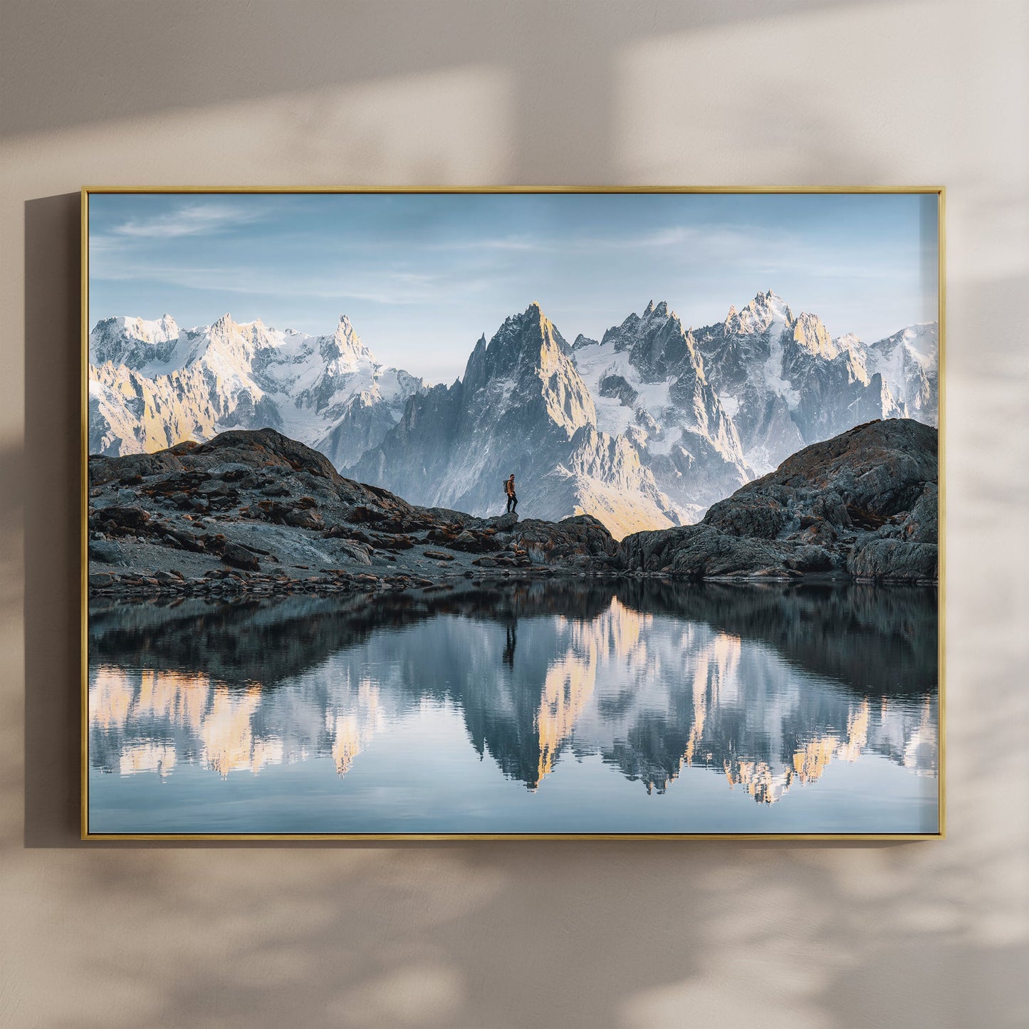 Mont Blanc wall art print with hiker at Lac Blanc reflected in a still alpine lake near Chamonix.