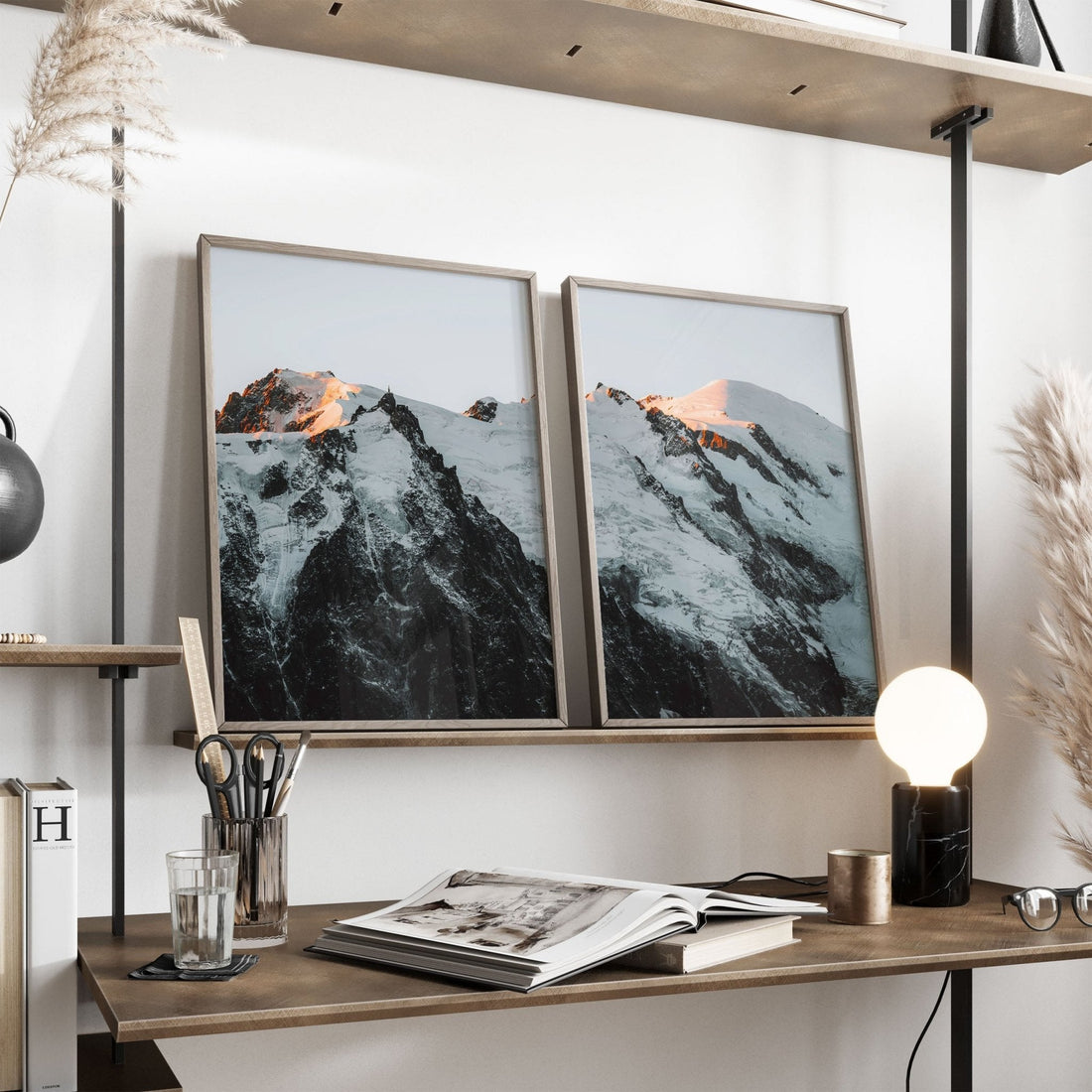 Elegant desk setup with framed Mont Blanc Massif photos in natural tones.