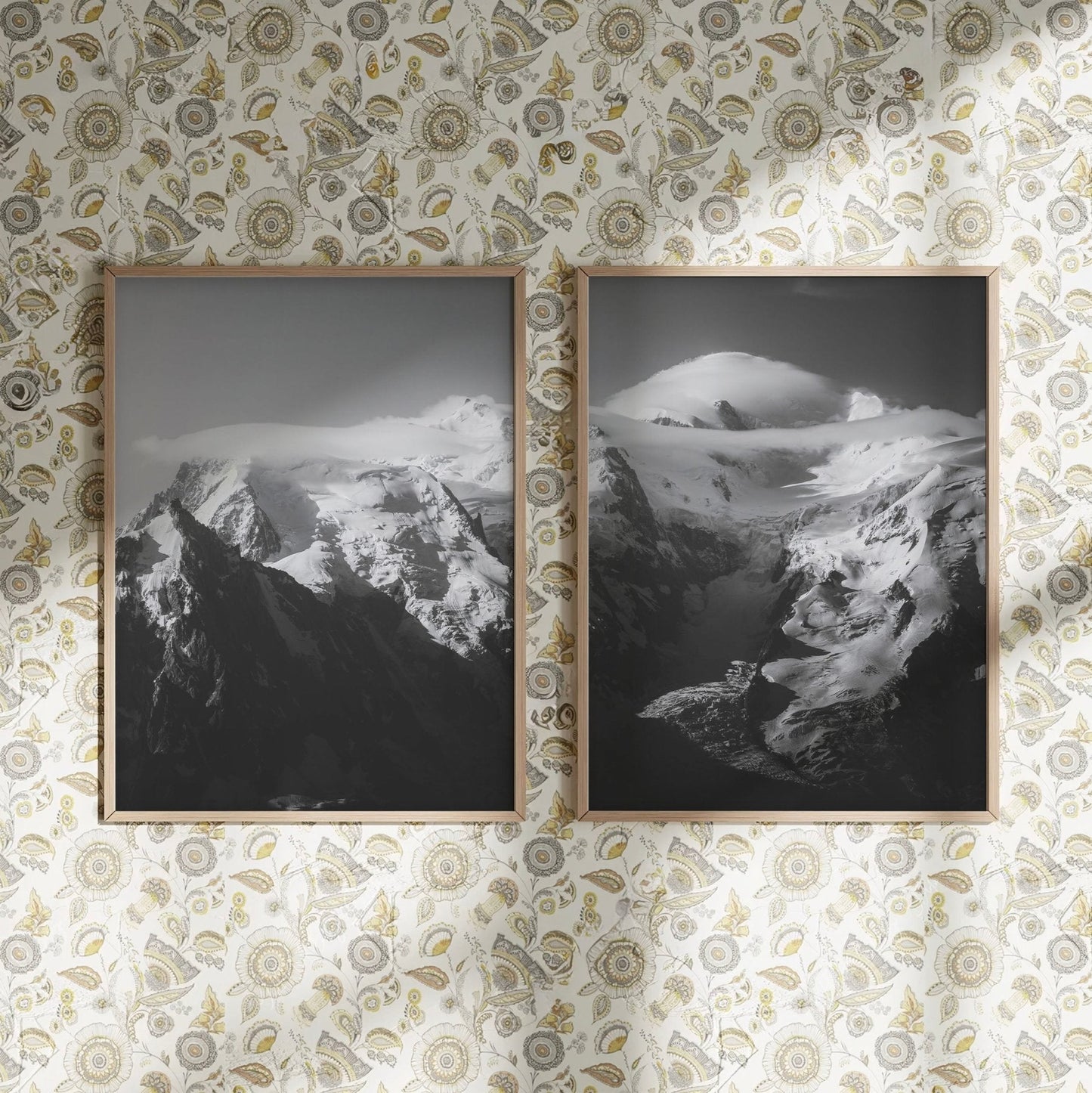 Monochrome framed Mont Blanc Massif print on a wall with elegant wallpaper and floral patterns.