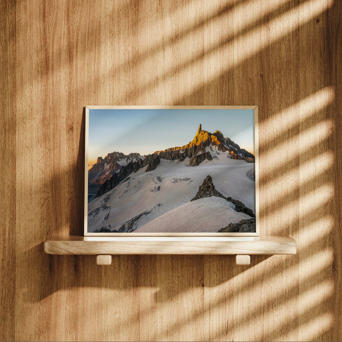 Scenic photo print of the Mont Blanc Massif with Dent du Géant bathed in golden morning light.