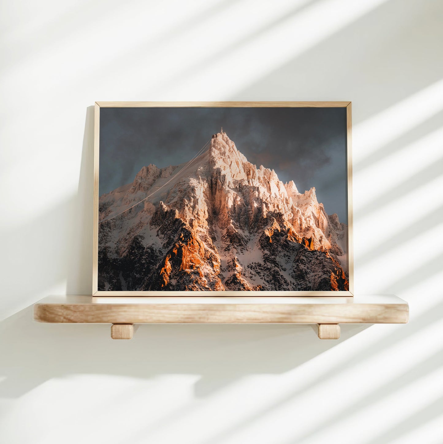 Stunning wall art of the Mont Blanc region with snowy Aiguille du Midi rising at sunrise over the Alps.