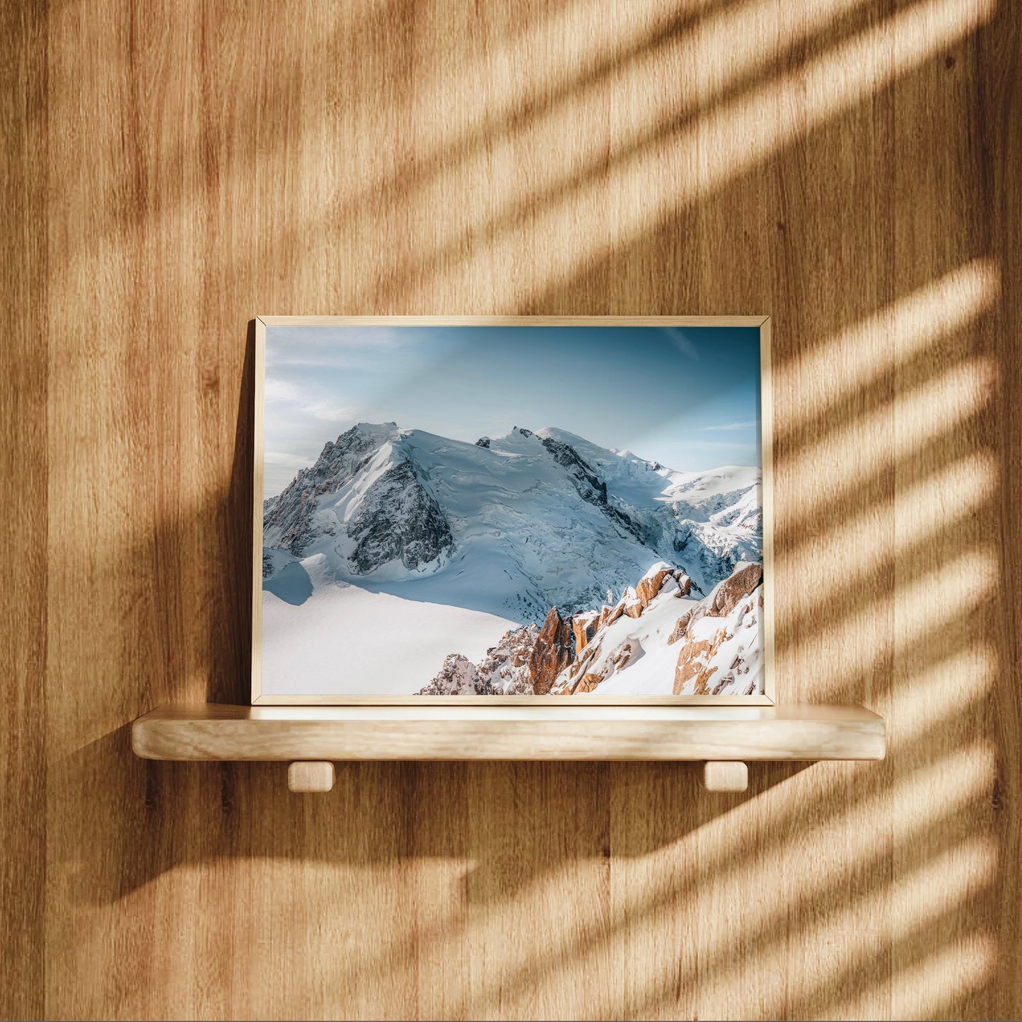 Snow-covered Mont Blanc ridge with sharp Cosmiques spires in a serene winter photography print.