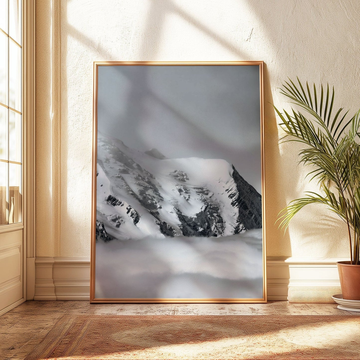 Snow-covered Mont Blanc peak emerging through low-hanging clouds, framed elegantly in a minimalistic room