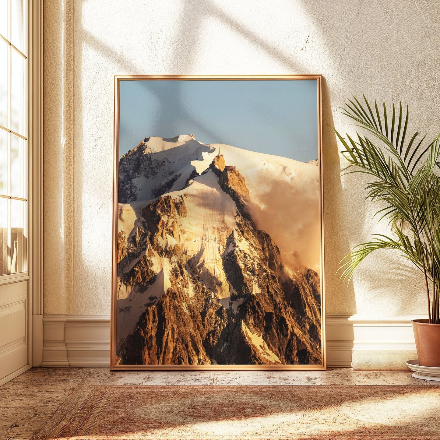 Close-up of the Mont Blanc peaks bathed in warm sunrise alpenglow, showcasing the intricate details of the snow-covered ridges.