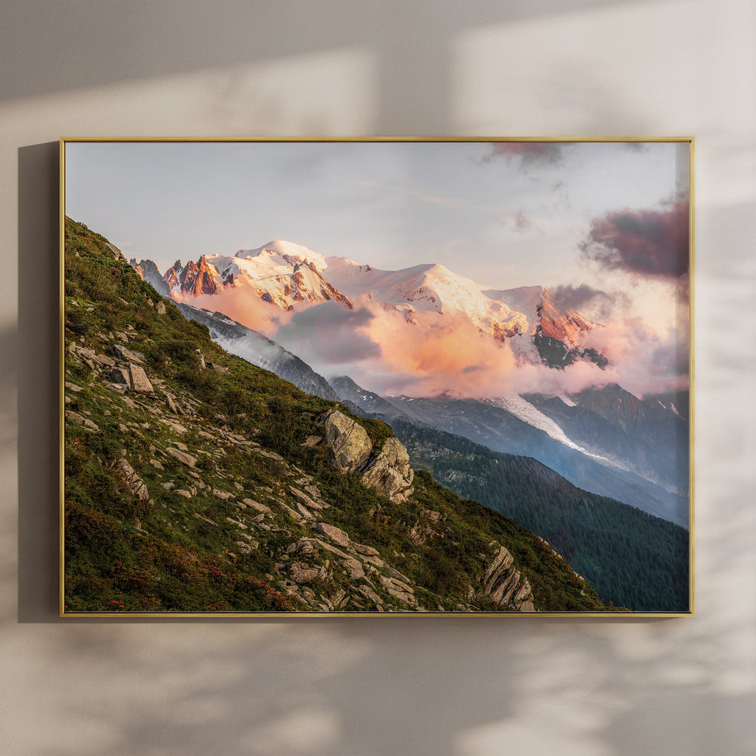 Dreamy sunset wall print of Mont Blanc Massif glowing through golden clouds over Chamonix, France.