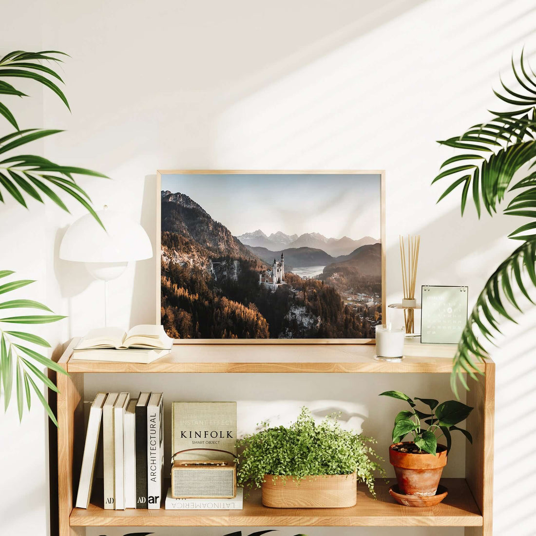 Framed print of a castle in the mountains at sunset