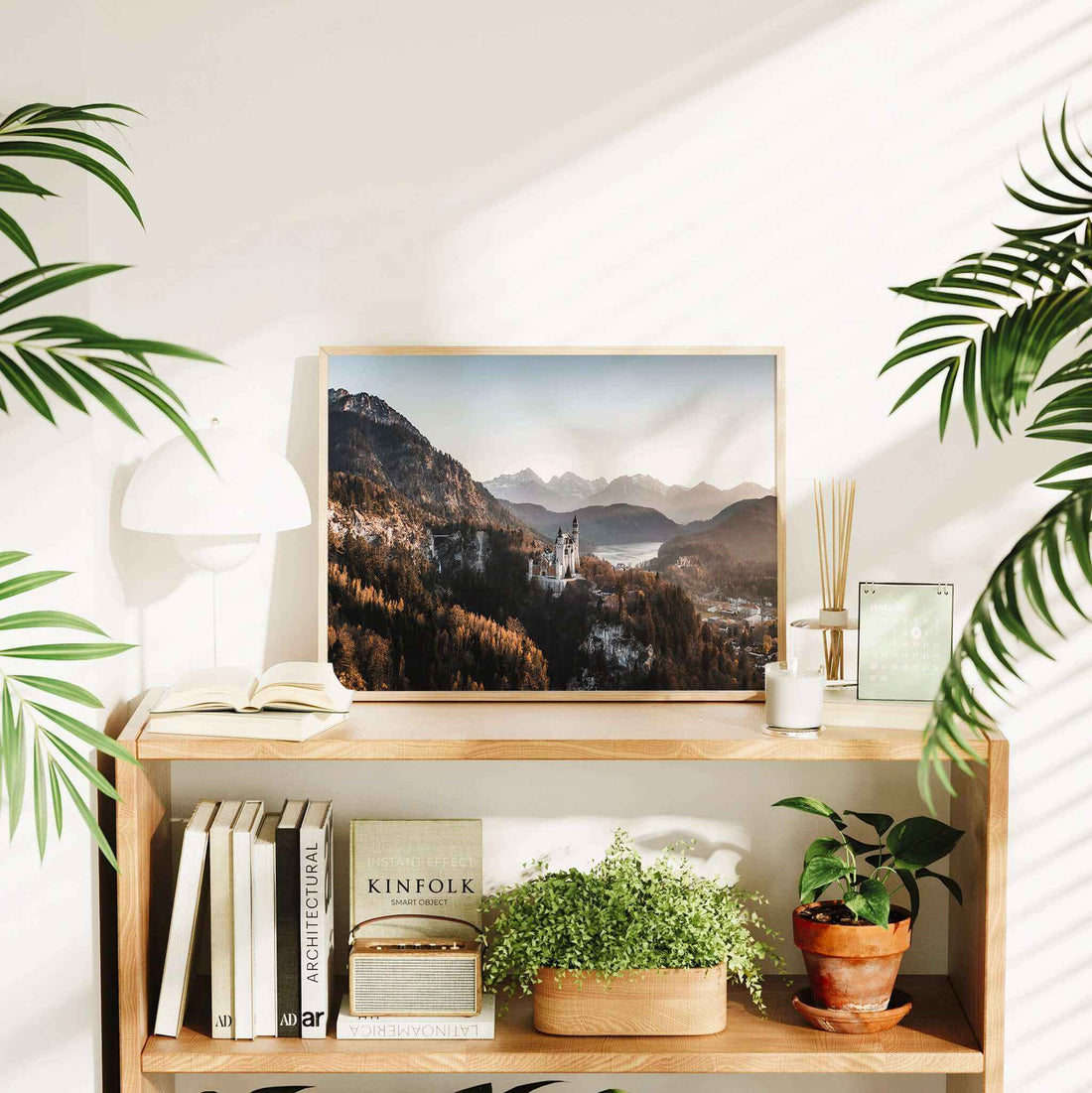 Framed print of a castle in the mountains at sunset