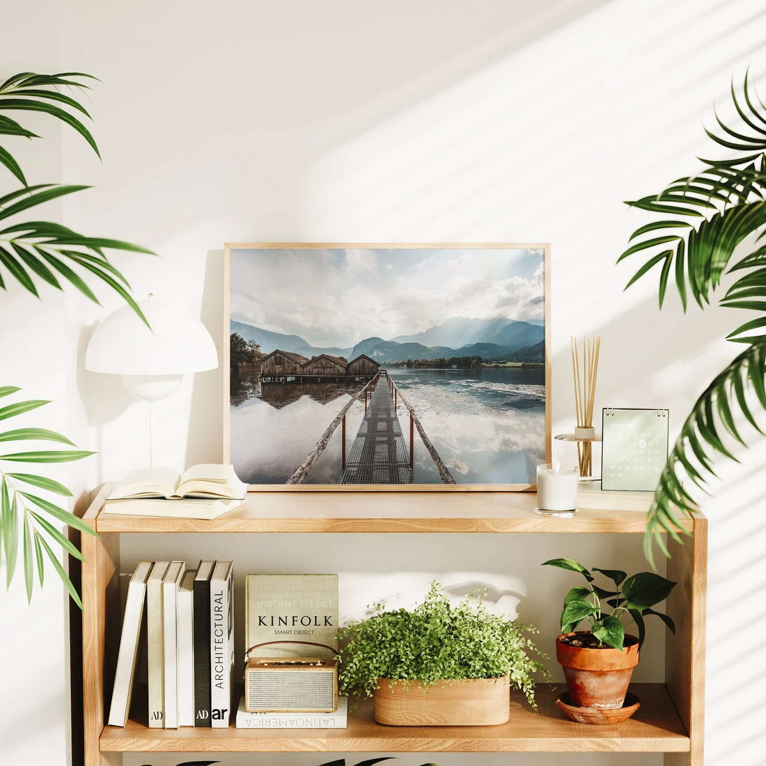 Still lake view of Kochelsee with classic wooden boathouses and mountains