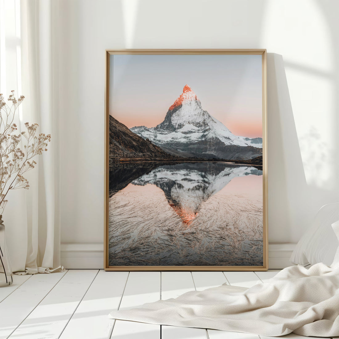 A breathtaking sunrise over Riffelsee with the Matterhorn reflecting in its pristine waters, a perfect landscape print.