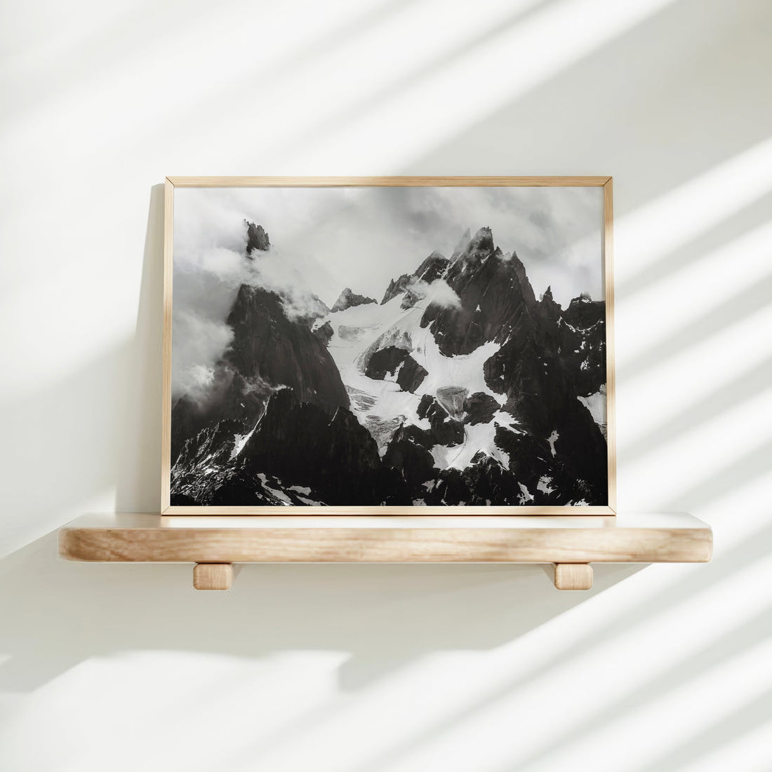 Black and white art print of towering mountain peaks in Chamonix, perfect for a modern alpine interior.