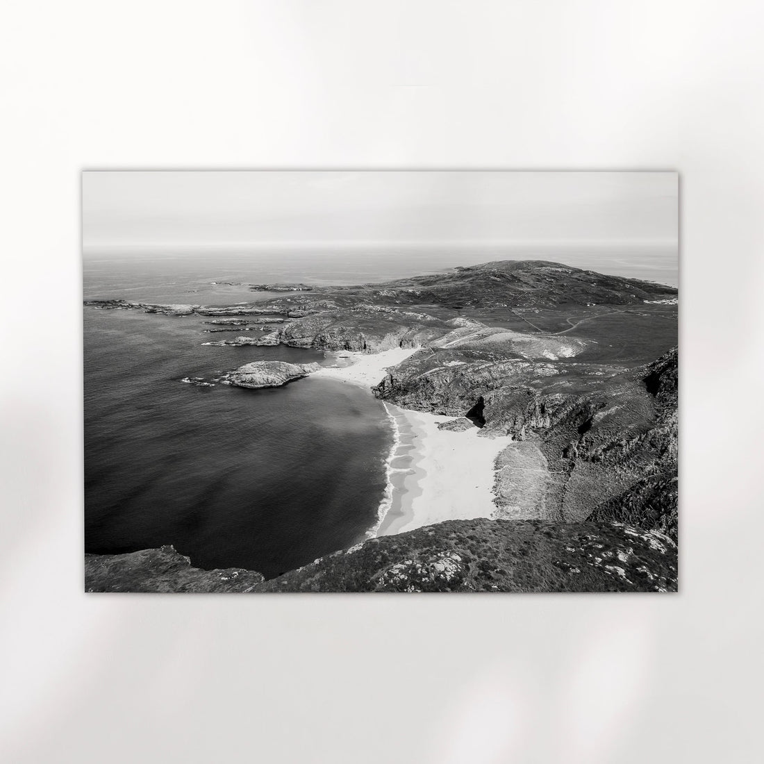 Unframed black and white photo of Murder Hole Beach displayed on a white background.