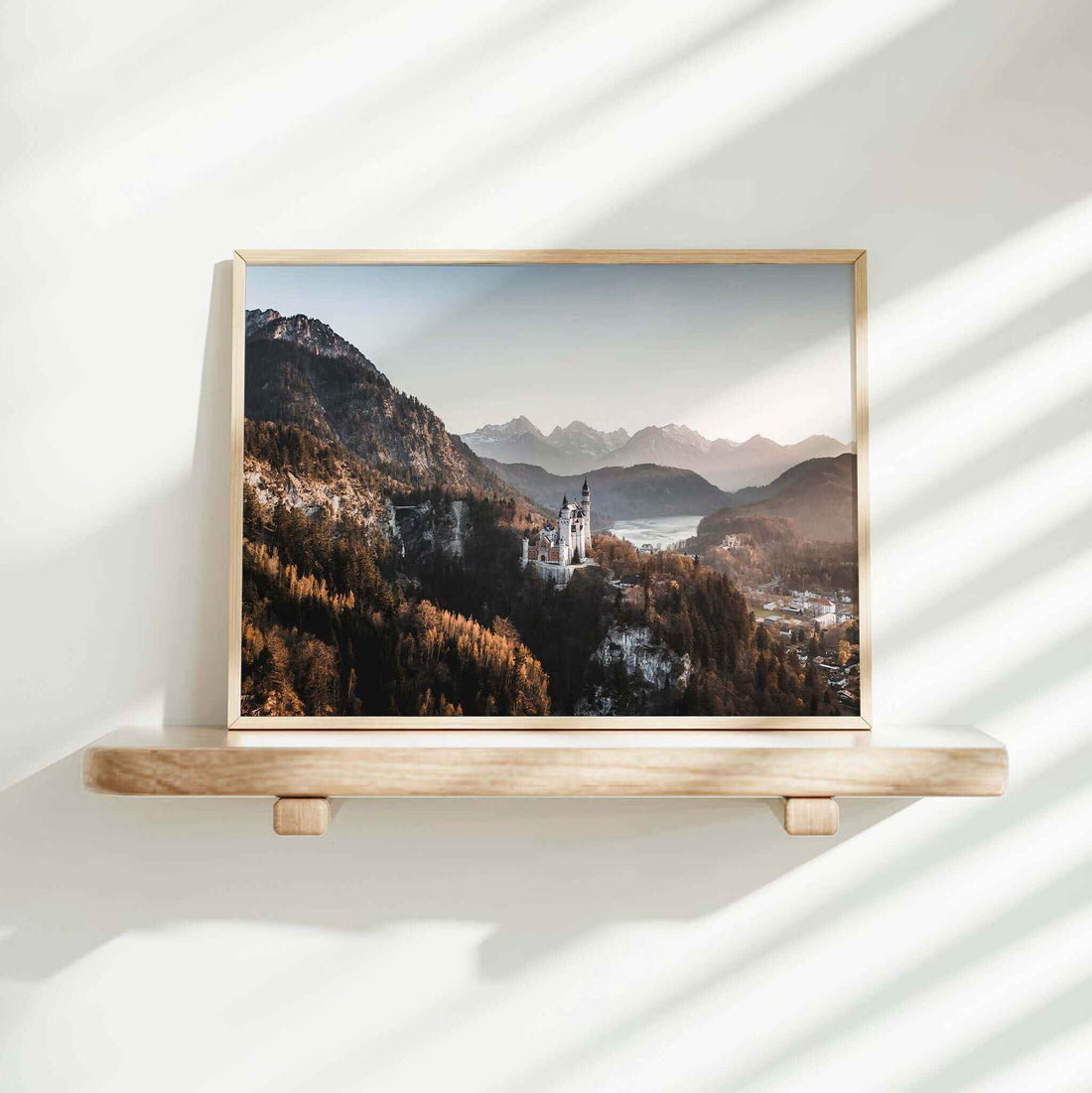 Photography print of Neuschwanstein Castle with early morning mist and mountain peaks