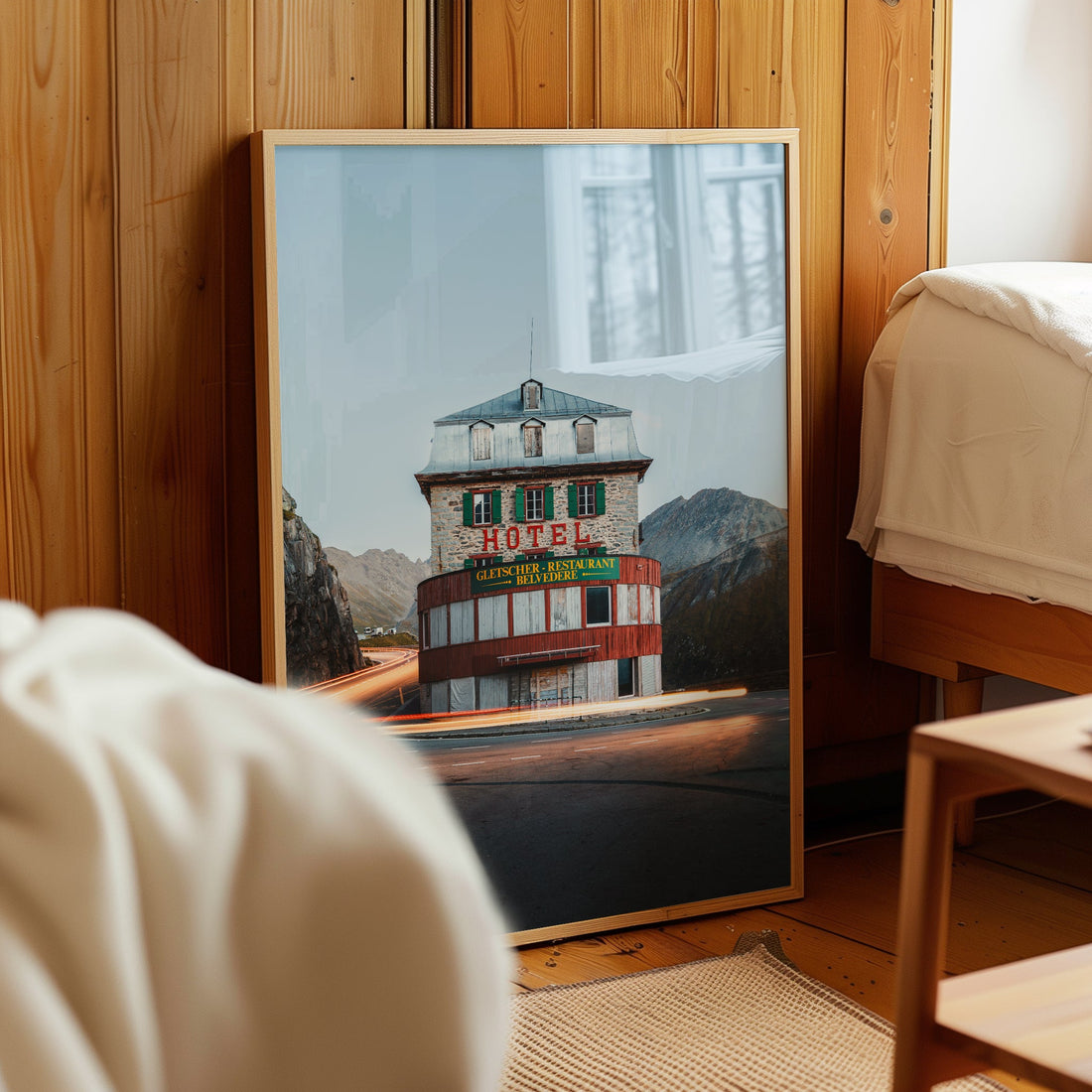 Atmospheric long-exposure photo print of Belvedere Hotel with car light trails at Furka Pass.