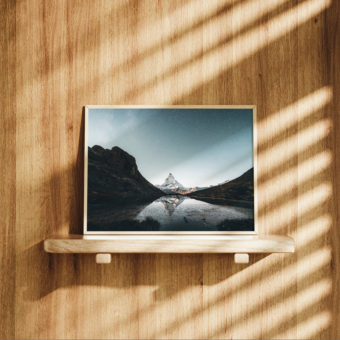 Breathtaking nightscape mountain lake photo print of the Matterhorn glowing under a star-filled sky.