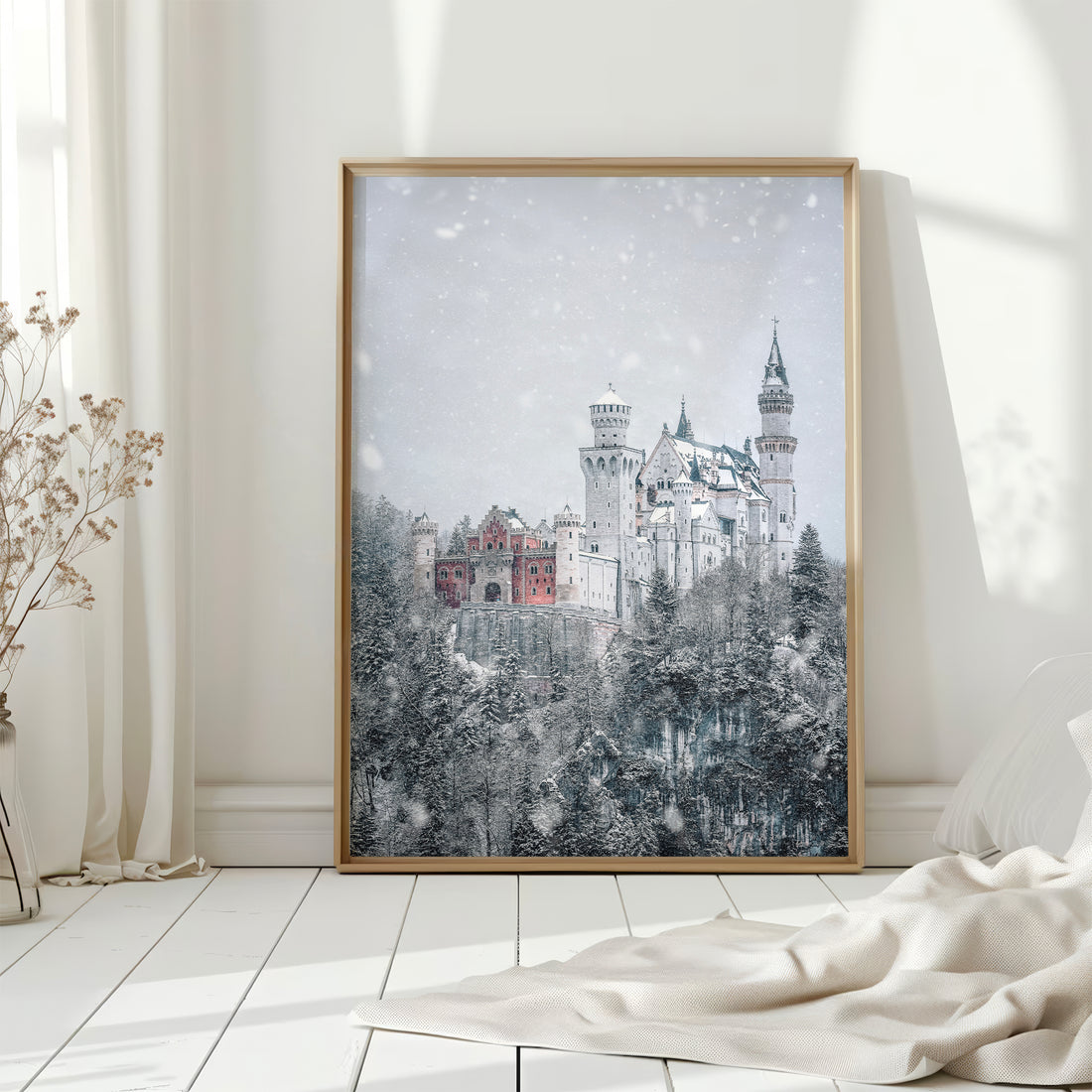 Framed Neuschwanstein Castle photography print in bright Scandinavian room