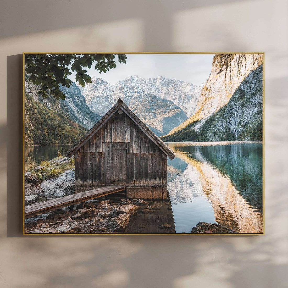 Wooden boathouse on Obersee lake with mountains in the background