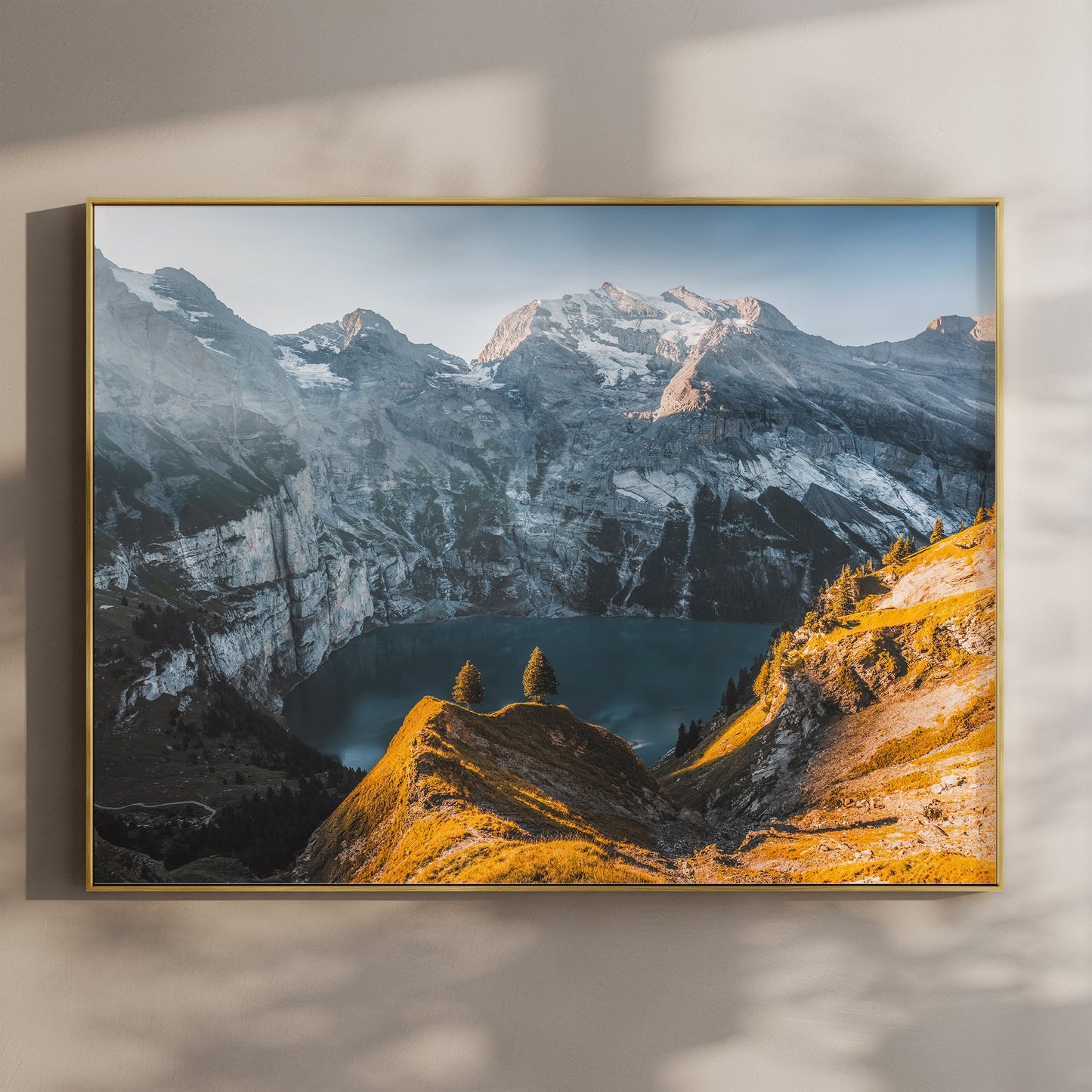 Fine art print of Oeschinensee with golden alpine ridges and dramatic Swiss mountain backdrop at sunrise.