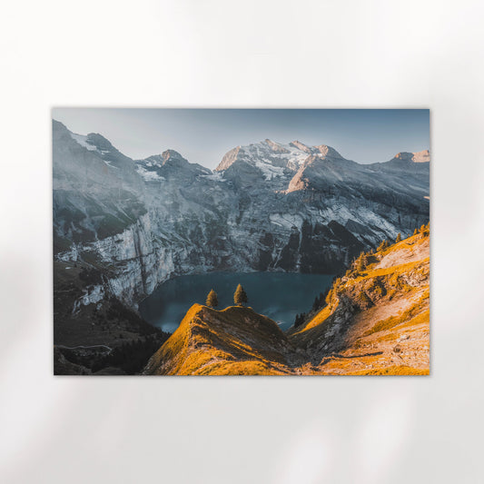 Scenic Oeschinensee Switzerland mountain print showcasing turquoise lake and snowy alpine peaks in golden hour.