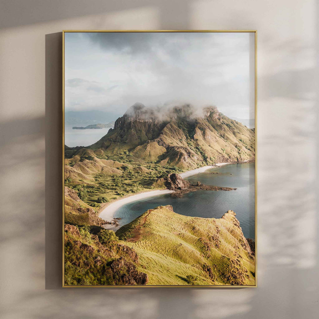Padar Island Komodo National Park wall art print in gold floating frame mounted on beige wall with natural shadows