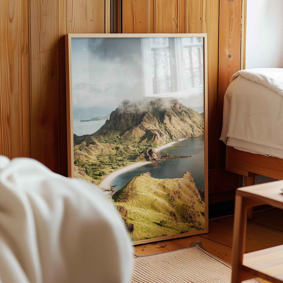 Padar Island Komodo National Park framed photography print leaning against wooden wall in cosy bedroom interior