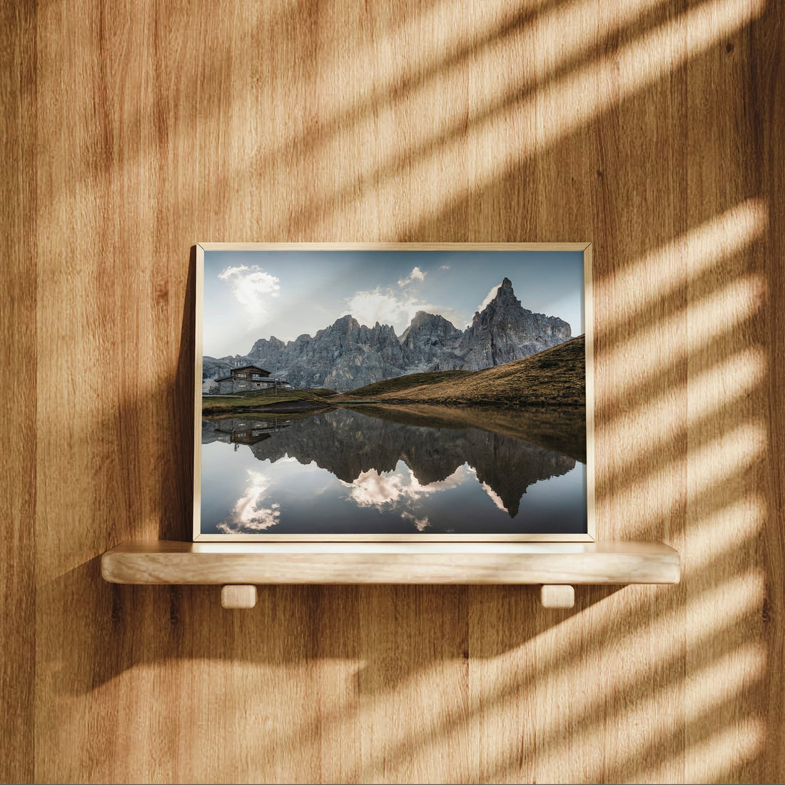 Passo Rolle reflection print styled on wooden shelf with dramatic shadows