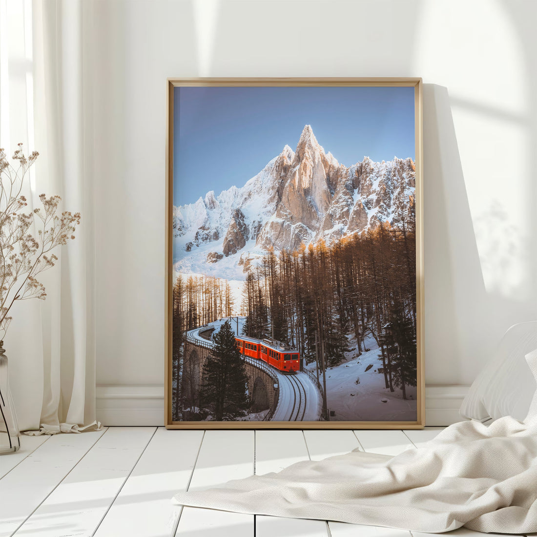 Eye-catching red Montenvers Train print against the stunning backdrop of the French Alps in winter.