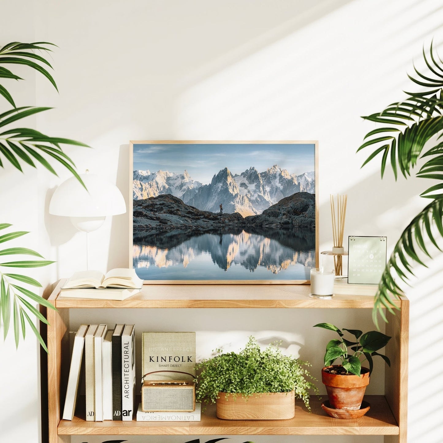 Fine art reflection print of Lac Blanc near Chamonix with a hiker and iconic alpine mountains.