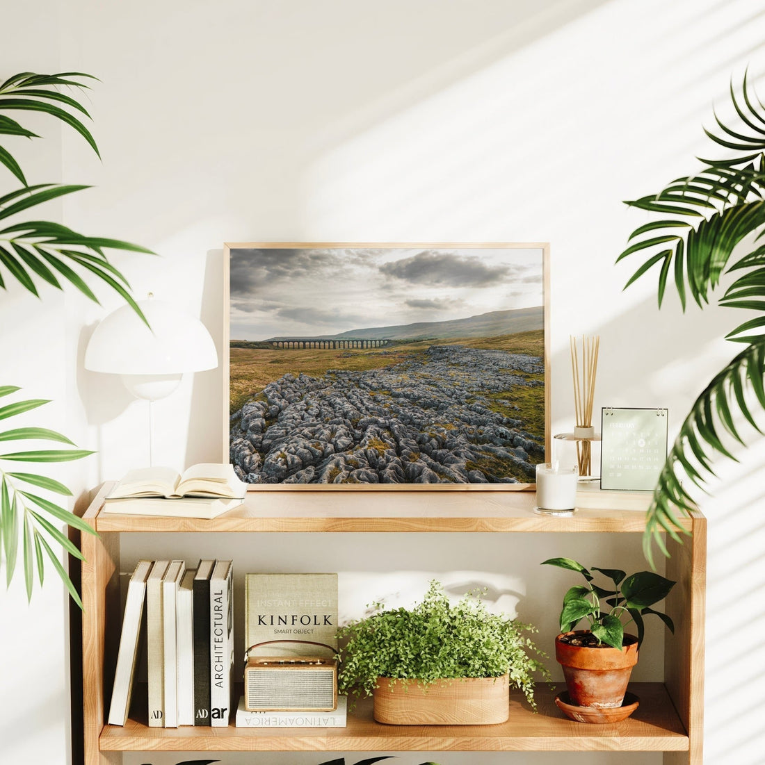 Ribblehead print styled in natural light with indoor plants and books