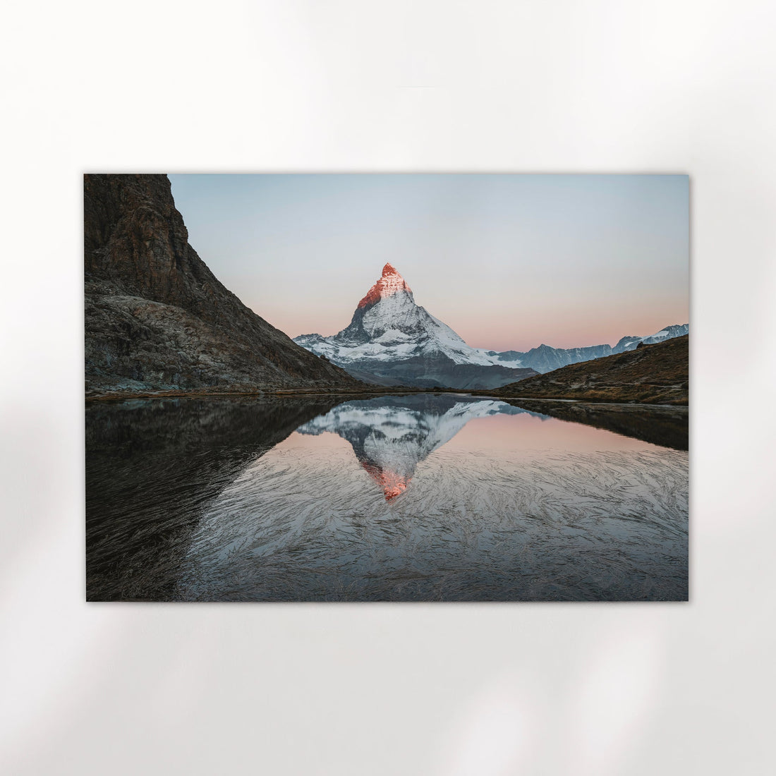 Riffelsee lake photography print showing a mirrored view of the Matterhorn at golden hour in Zermatt.