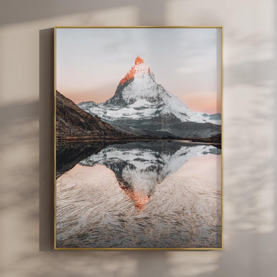 Serene Riffelsee lake with a perfect Matterhorn reflection at sunrise, a stunning Swiss Alps wall art print.