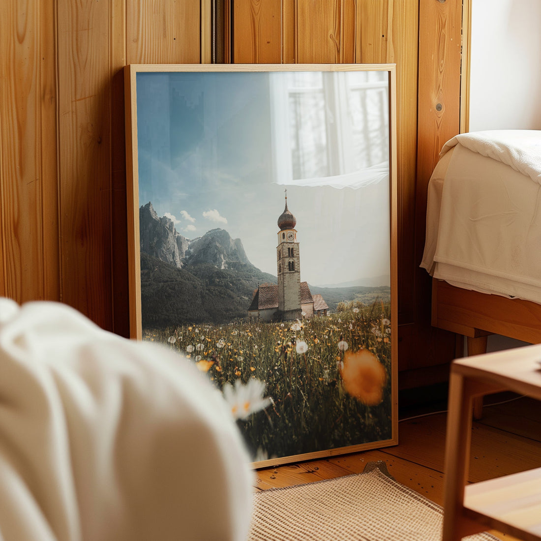 San Valentino Dolomites print leaning against a wooden wall in a cosy bedroom