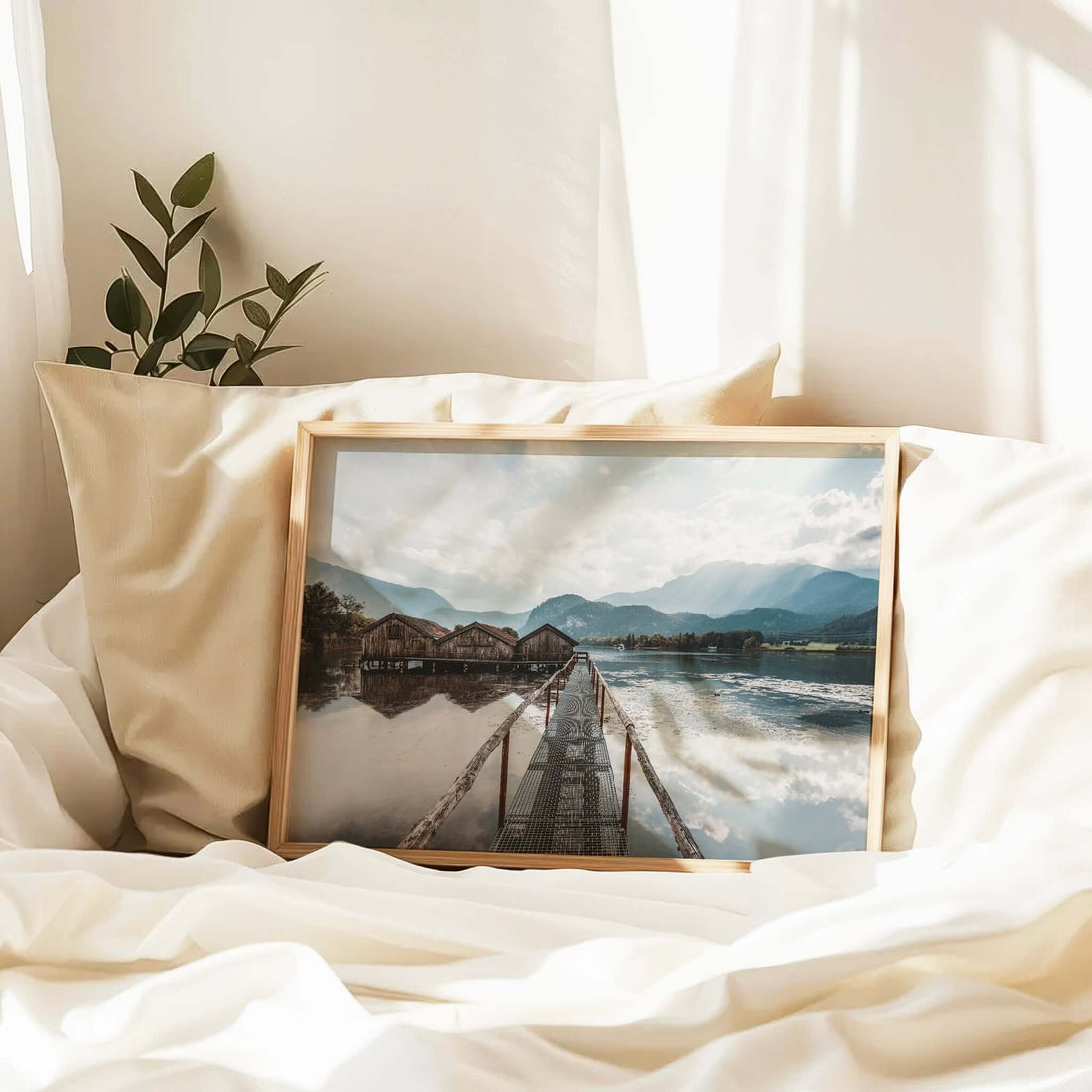 Bavarian lake scene with mist, reflections and weathered wooden huts