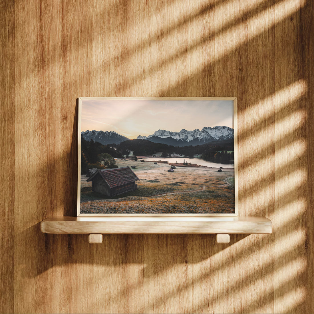 Bavarian interior with rustic wooden style and framed Geroldsee mountain print